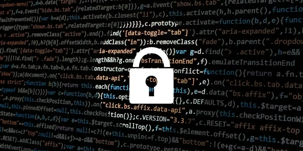 Zapomniałem hasła do laptopa. Widzę kod i ikonę kłódki, symbolizującą bezpieczeństwo i potencjalne problemy z dostępem.