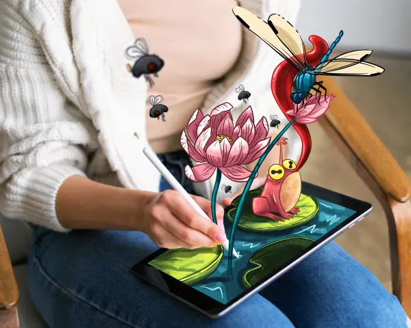 Osoba rysuje na tablecie za pomocą rysika, tworząc kolorowy świat z żabą, ważką i kwiatami. Świetne aplikacje do rysowania na tablecie ożywiają wyobraźnię.