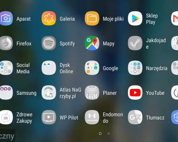 Ekran telefonu z ikonami aplikacji. Widoczny jest pasek "Tryb bezpieczny", co sugeruje, jak włączyć tryb awaryjny w telefonie.
