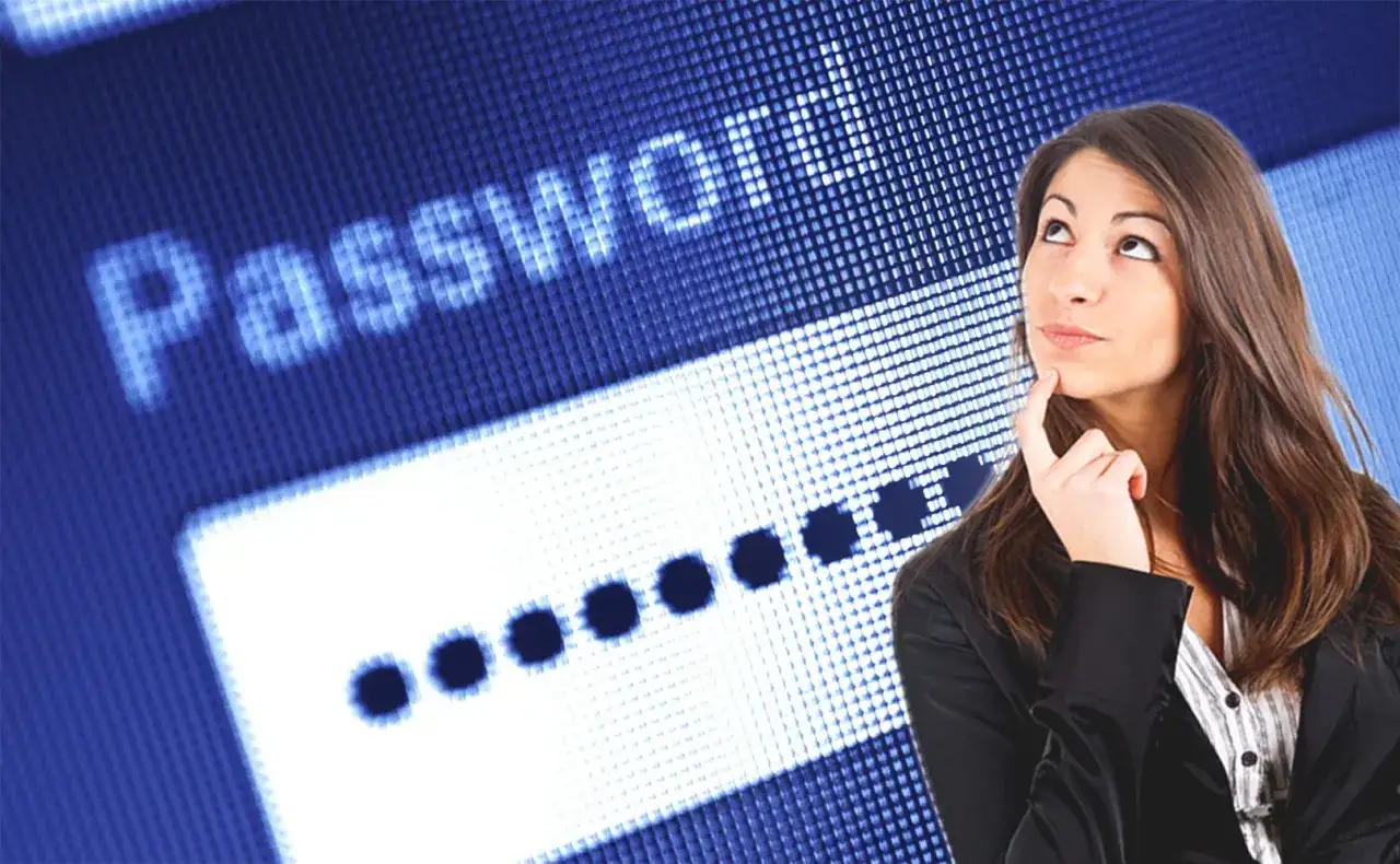 Kobieta zamyślona nad polem wpisywania hasła. Czyżby zapomniałem hasła do laptopa?